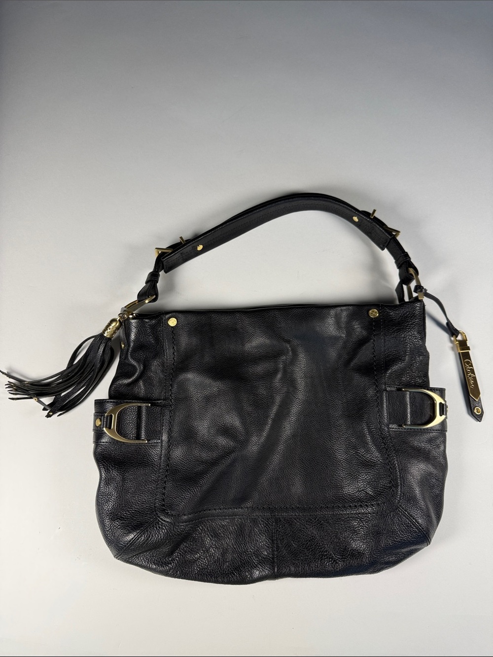 Cole Haan Black Leather Hobo Shoulder Bag with Tassel and Gold Accents
